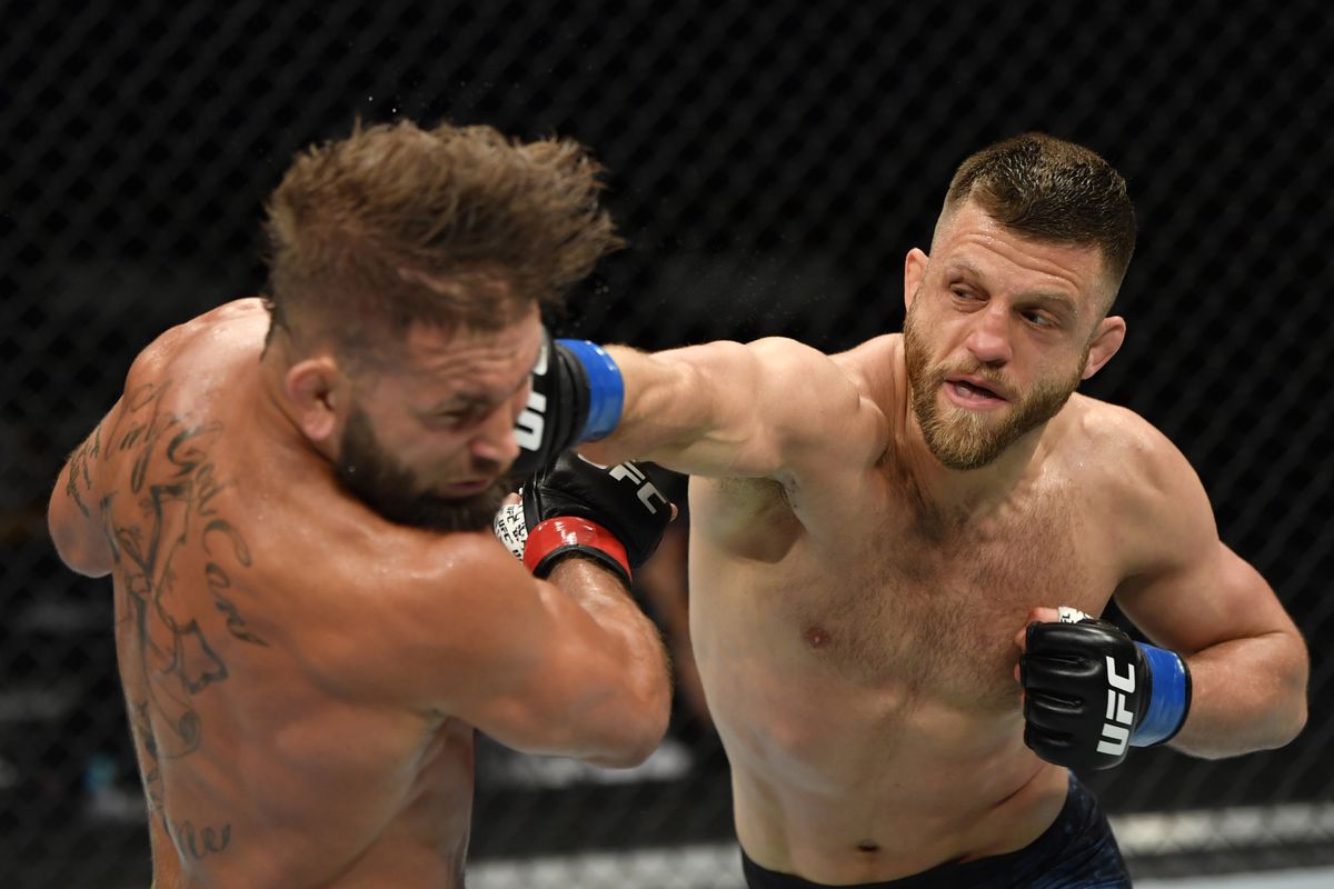 Calvin Kattar punches Jeremy Stephens in their featherweight fight during the UFC 249 event at VyStar Veterans Memorial Arena on May 09, 2020 in Jacksonville, Florida.