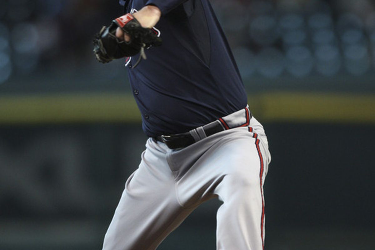 HOUSTON - JUNE 13:  Pitcher Derek Lowe #32 of the Atlanta Braves throws against the Houston Astros in the first inning at Minute Maid Park on June 13, 2011 in Houston, Texas.  (Photo by Bob Levey/Getty Images)