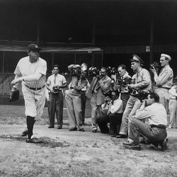 Baseball Hall of Famer Babe Ruth warms up for photographers at New York's Yankee Stadium Aug. 21, 1942, preparing for an exhibition against pitching great Walter Johnson to raise money for the Army-Navy Relief Fund during World War II.