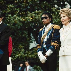 FILE - In this May 14, 1984, file photo, Michael Jackson, center, stands with President Ronald Reagan, left, and first lady Nancy Reagan on the south lawn of the White House prior to receiving an award from the president for his contribution to the drunk driving awareness program. The former first lady has died at 94, The Associated Press confirmed Sunday, March 6, 2016. 