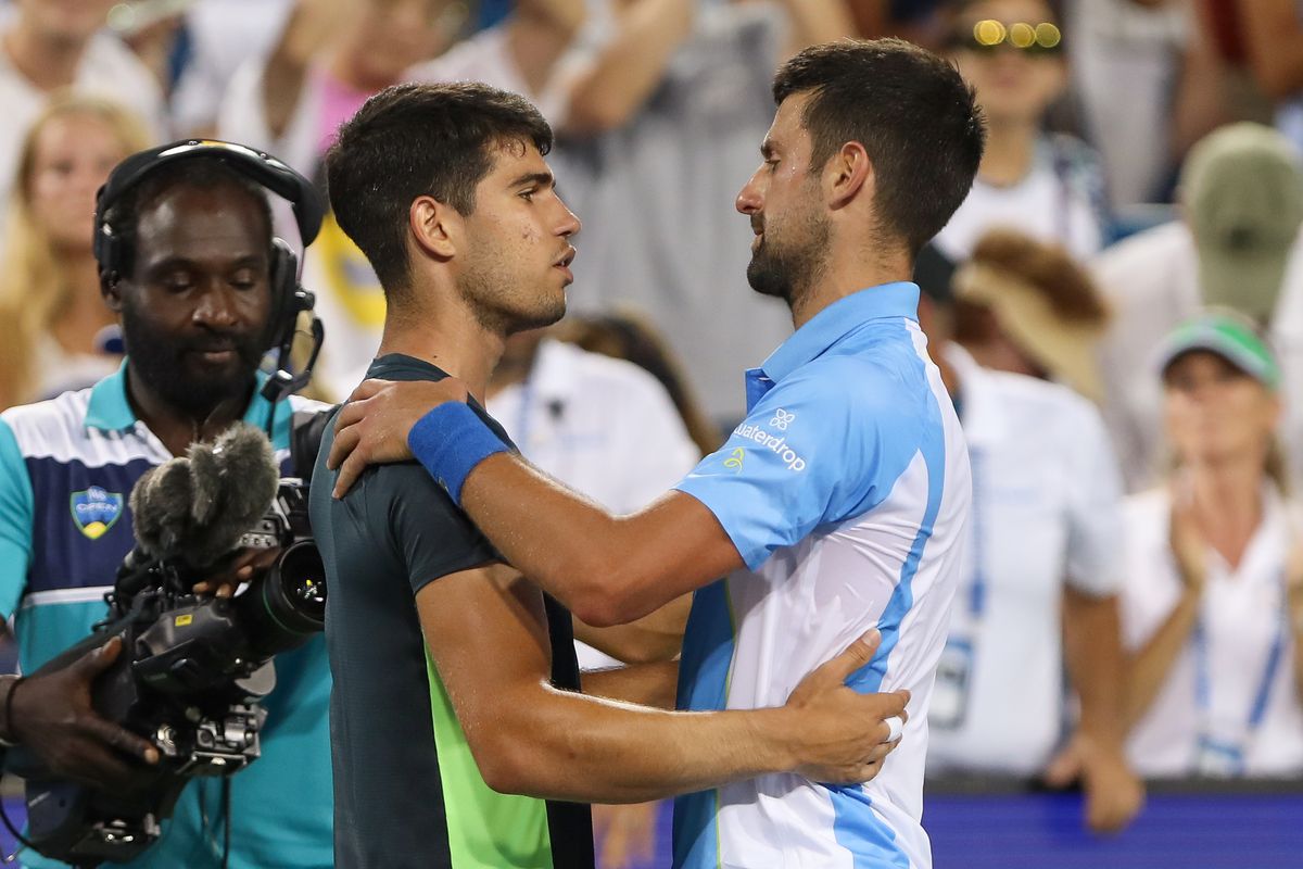 Carlos Alcaraz of Spain shakes hands with Novak Djokovic of Serbia after the final round at the Western &amp; Southern Open at Lindner Family Tennis Center on August 20, 2023 in Mason, Ohio.
