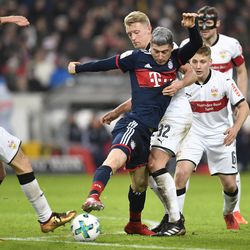 Lewandowski is swarmed by Stuttgart players during Bayern vs. Stuttgart