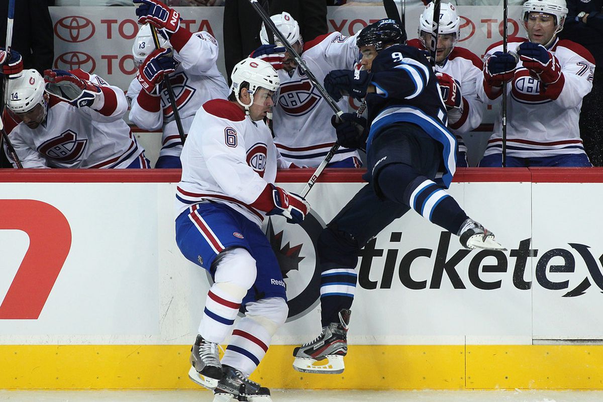 WINNIPEG, CANADA - OCTOBER 9: It wouldn't be an early season Habs game without another regular defenseman getting hurt, now would it?  (Photo by Marianne Helm/Getty Images)