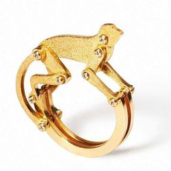 <a href=http://marcalary.com/products/monkey-ring-with-diamonds">Marc Alary</a>