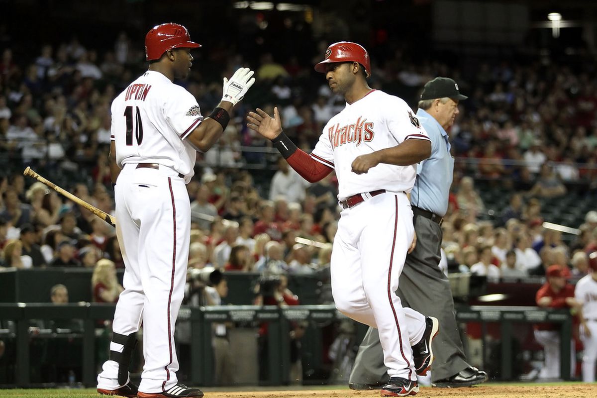 Juan Miranda, here seen receiving a mystery hi-five, wasn't the only first baseman in the D-backs organization who flashed some heavy power on Tuesday.