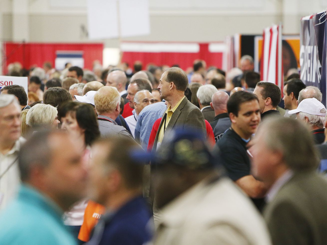 Attendees walk through the Republican State Convention at South Towne Expo Center in Sandy Saturday, April 26, 2014.