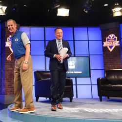 At left, Tom Holmoe, director of athletics at Brigham Young University, laughs with host Dave McCann after an interview on BYUTV during the BYU football media day in the BYU Broadcasting Building in Provo on Friday, June 22, 2018.