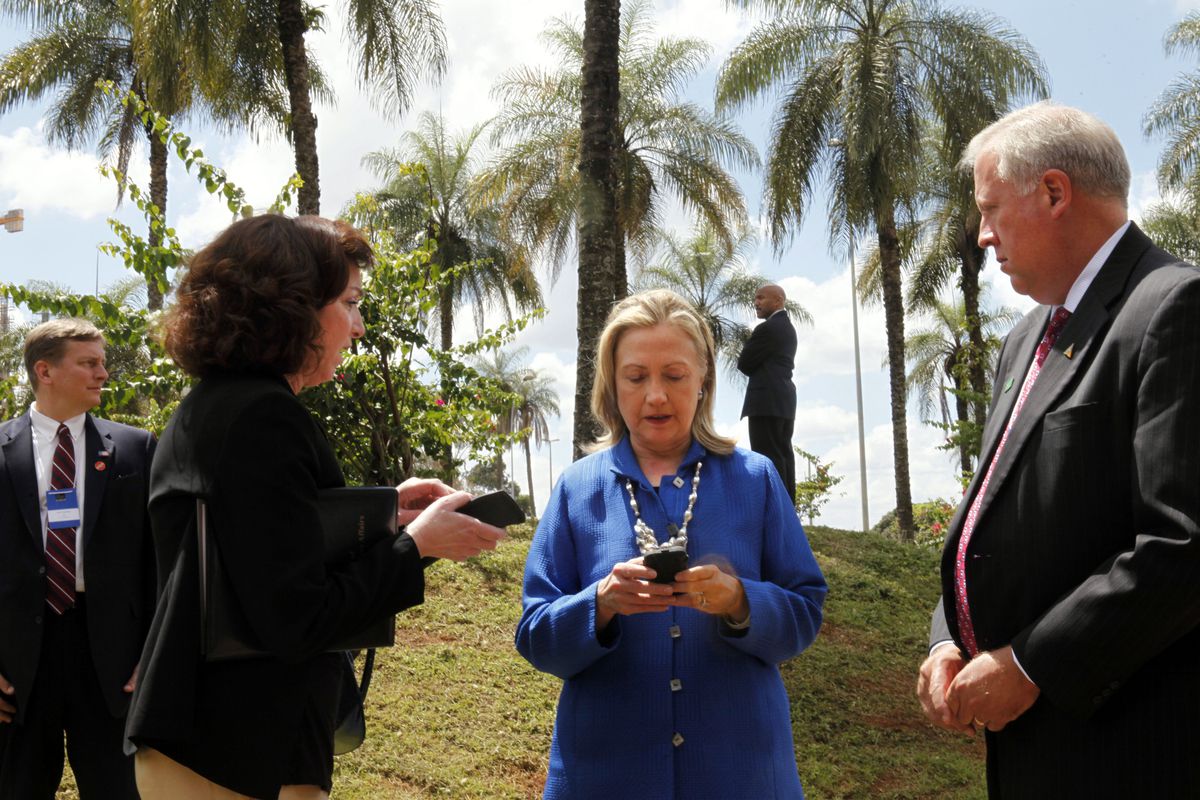 Secretary Clinton on her phone in Brasilia in 2012.