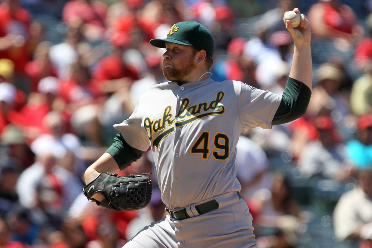 ANAHEIM, CA - MAY 26:  Brett Anderson #49 of the Oakland Athletics throws a pitch against the Los Angeles Angels of Anaheim on May 26, 2011 at Angel Stadium in Anaheim, California.  Oakland won 4-3.  (Photo by Stephen Dunn/Getty Images)