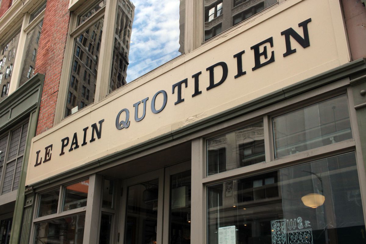 The exterior of the bakery Le Pain Quotidien with the letters seen in black