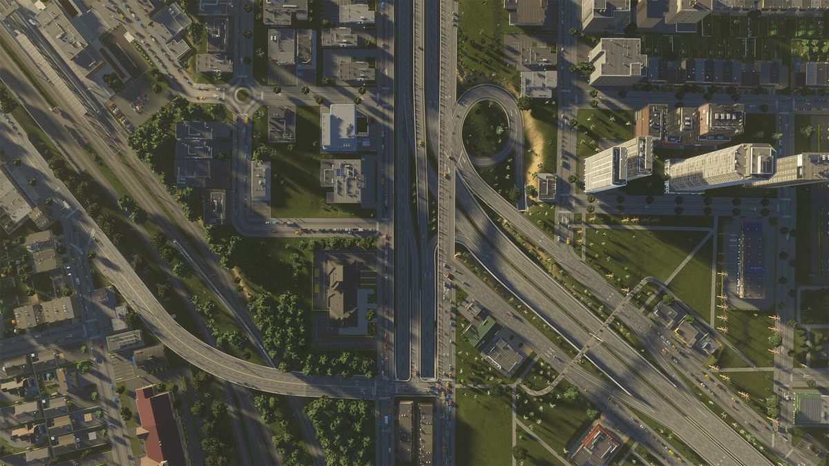 A god’s eye view of a highway system sprinkled with green trees