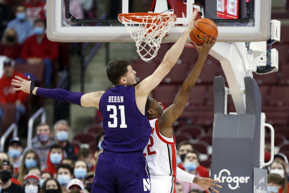 Ohio State guard Malaki Branham, right, goes up to shoot in front of Northwestern forward Robbie Beran during Sunday’s game in Columbus, Ohio. 
