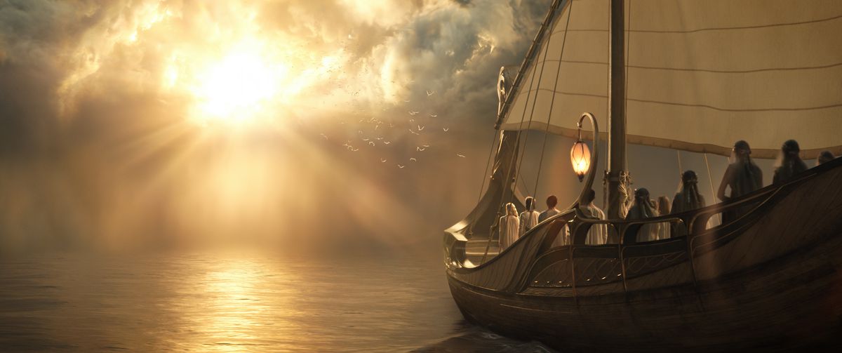 A boat of elves approaches a cloudbank on the surface of the sea, bursting with light in The Lord of the Rings: The Rings of Power.