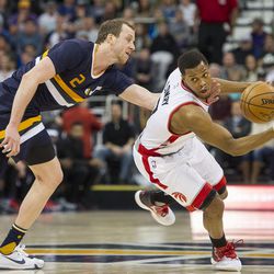 Utah forward Joe Ingles (2) tries to steal the ball from Toronto guard Kyle Lowry (7) during an NBA basketball game in Salt Lake City on Friday, Dec. 23, 2016. Toronto took down Utah with a final score of 104-98.