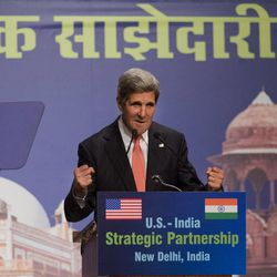 U.S. Secretary of State John Kerry gestures while making a speech that was in part about climate change at the India Habitat Center in New Delhi, India on Sunday, June 23, 2013, on his first visit to India as secretary. 