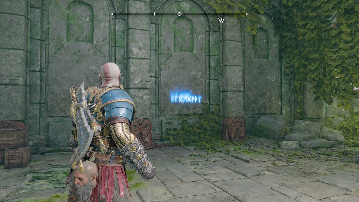 Kratos reads some runes off the wall