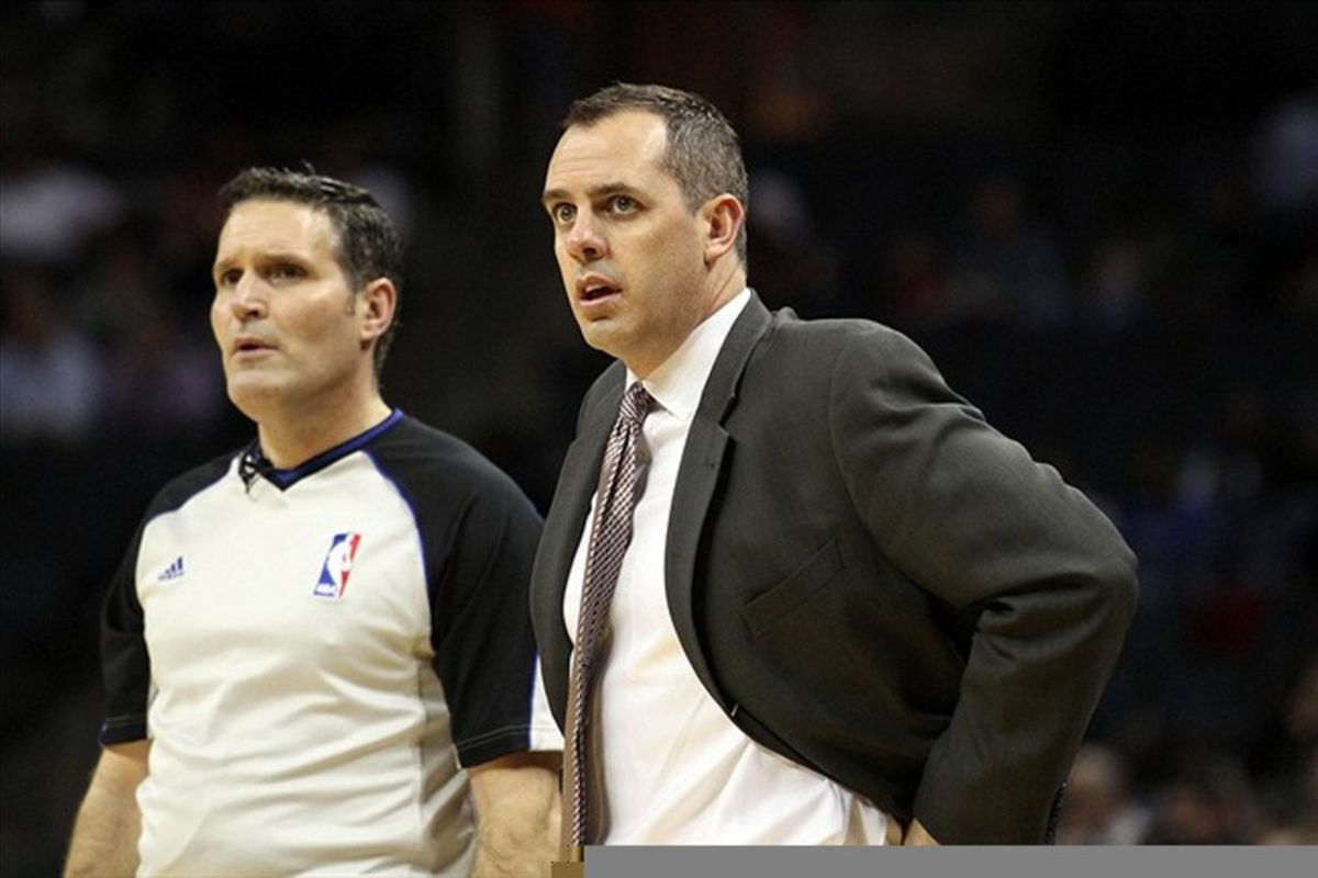 Feb 22, 2012; Charlotte, NC, USA;  Indiana Pacers head coach Frank Vogel talks with a referee during the first half against the Charlotte Bobcats at Time Warner Cable Arena. Mandatory Credit: Jeremy Brevard-US PRESSWIRE