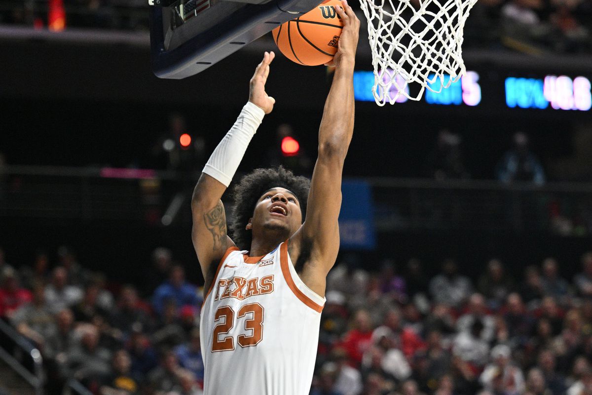 Texas Longhorns forward Dillon Mitchell shoots the ball against Penn State Nittany Lions guard Andrew Funk during the second half at Wells Fargo Arena.