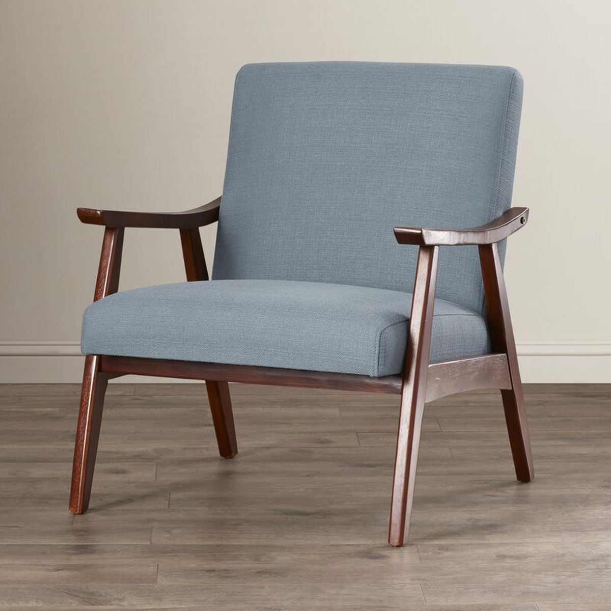 Lounge chair with wooden legs and blue upholstery.