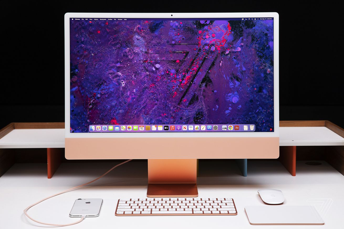 An image showing an iMac with a galaxy screensaver