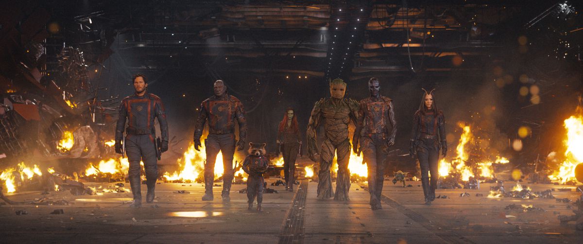 The Guardians of the Galaxy walk in a line in front of a bunch of stuff on fire in Guardians of the Galaxy Vol. 3.