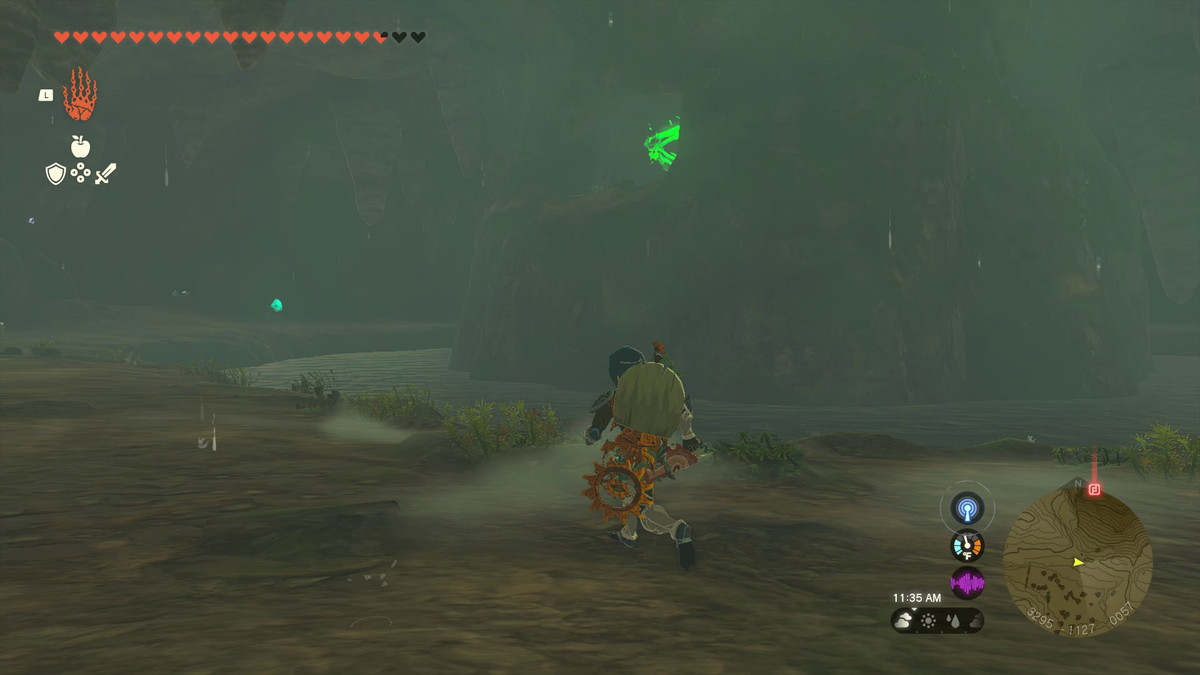 Link runs beside the moat that surrounds Jogou Shrine, the edge of which can be see from its perch inside of a tall rock structure