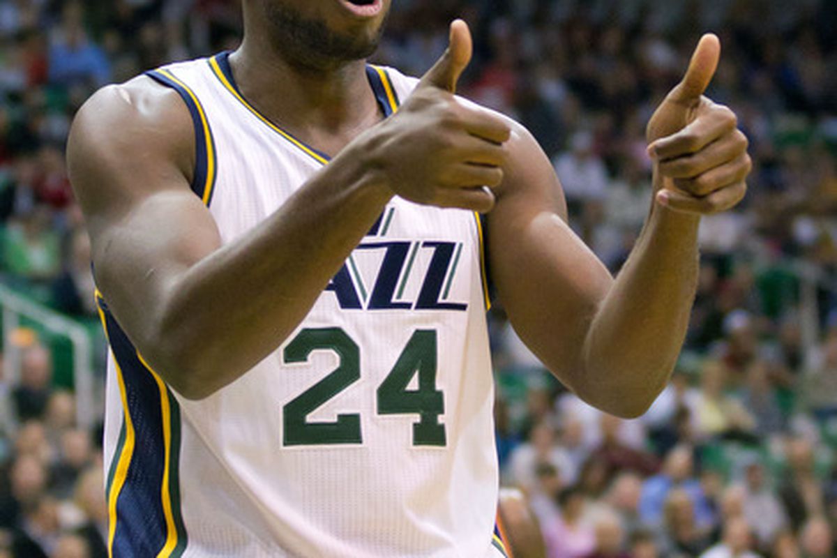 March 20, 2012; Salt Lake City, UT, USA; Utah Jazz power forward Paul Millsap (24) signals for a jump ball during the first quarter against the Oklahoma City Thunder at Energy Solutions Arena. Mandatory Credit: Russ Isabella-US PRESSWIRE