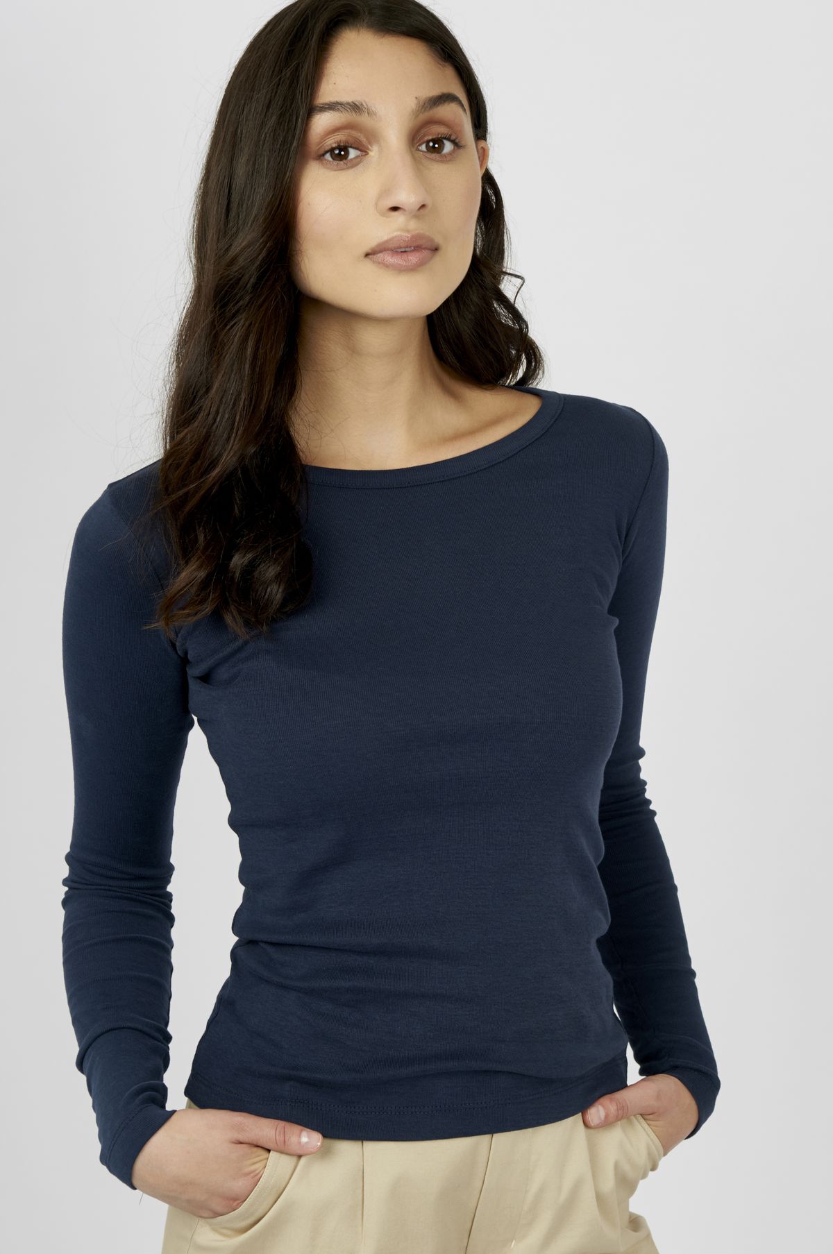 A model in a blue longsleeve shirt