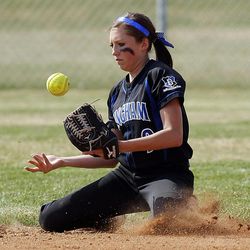 Bingham's Sam Wachter juggles the ball as she catches it as Riverton and Bingham play Wednesday, April 3, 2013 at Riverton.