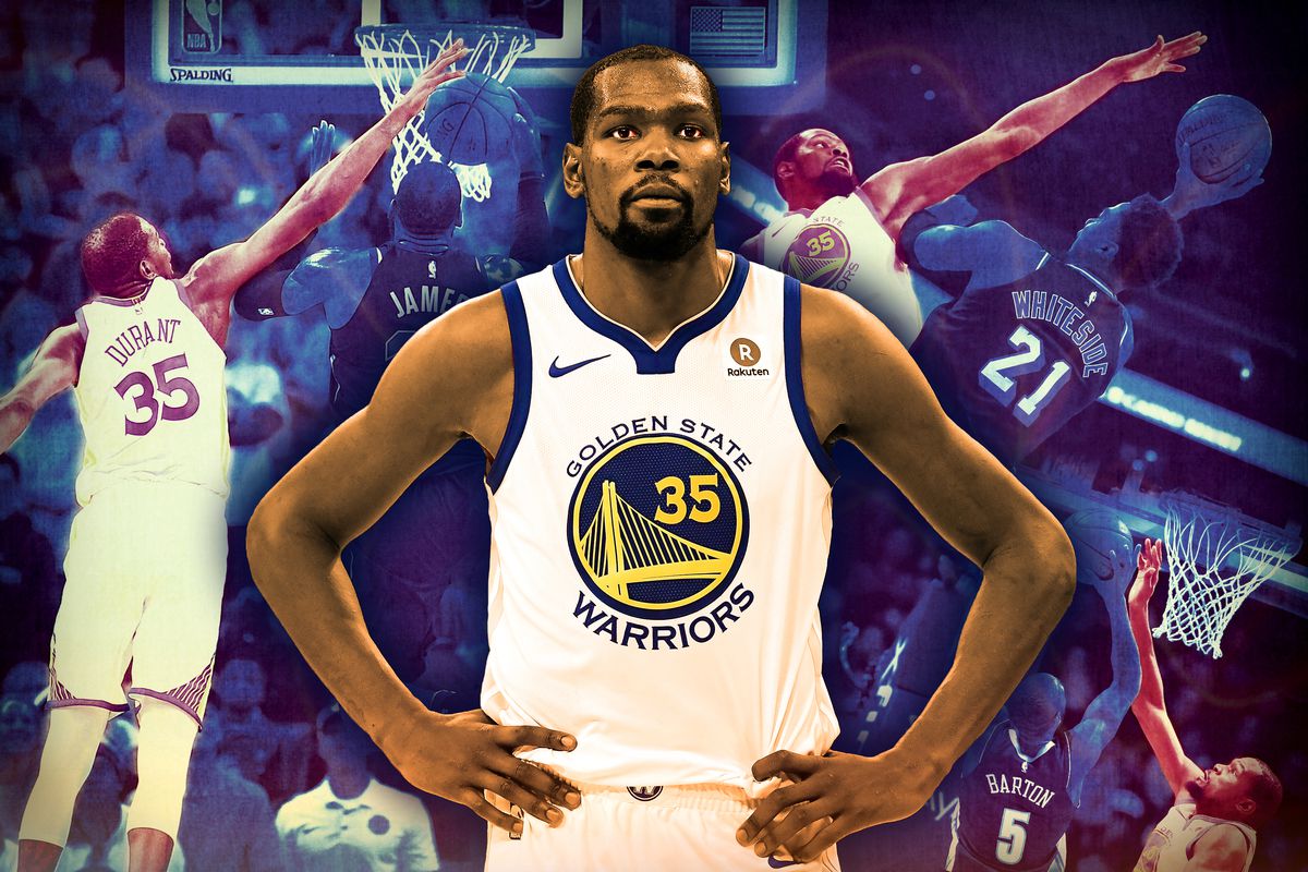 Kevin Durant stands with his hands on his hips