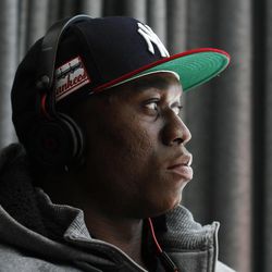 Ziggy Ansah, defensive end from Brigham Young University, peers out a window from the Beats by Dre party suite in the hours before the 2013 NFL Draft begins, April 25 in New York.