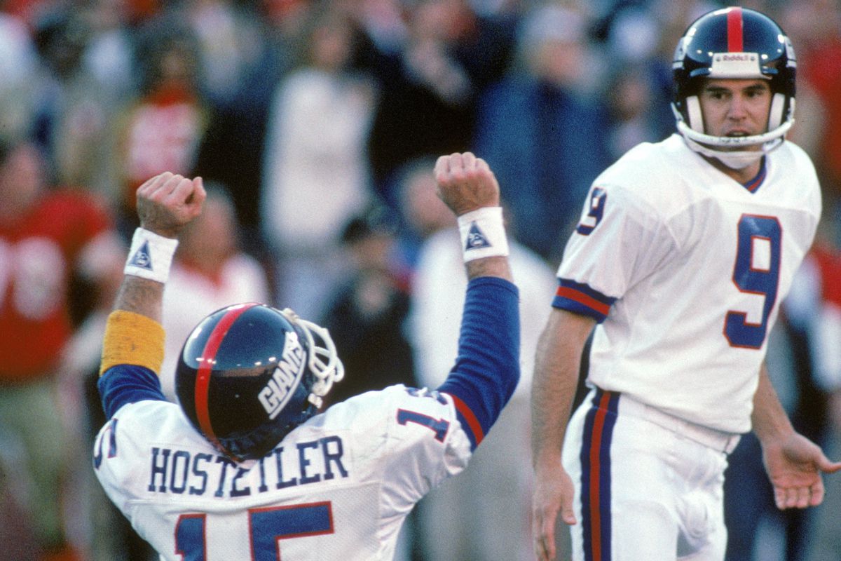 Quarterback Jeff Hostetler and kicker Matt Bahr of the New York Giants celebrate the winning field goal with no time left in the 1990 NFC Championship game against the San Francisco 49ers at Candlestick Park on January 20, 1991 in San Francisc