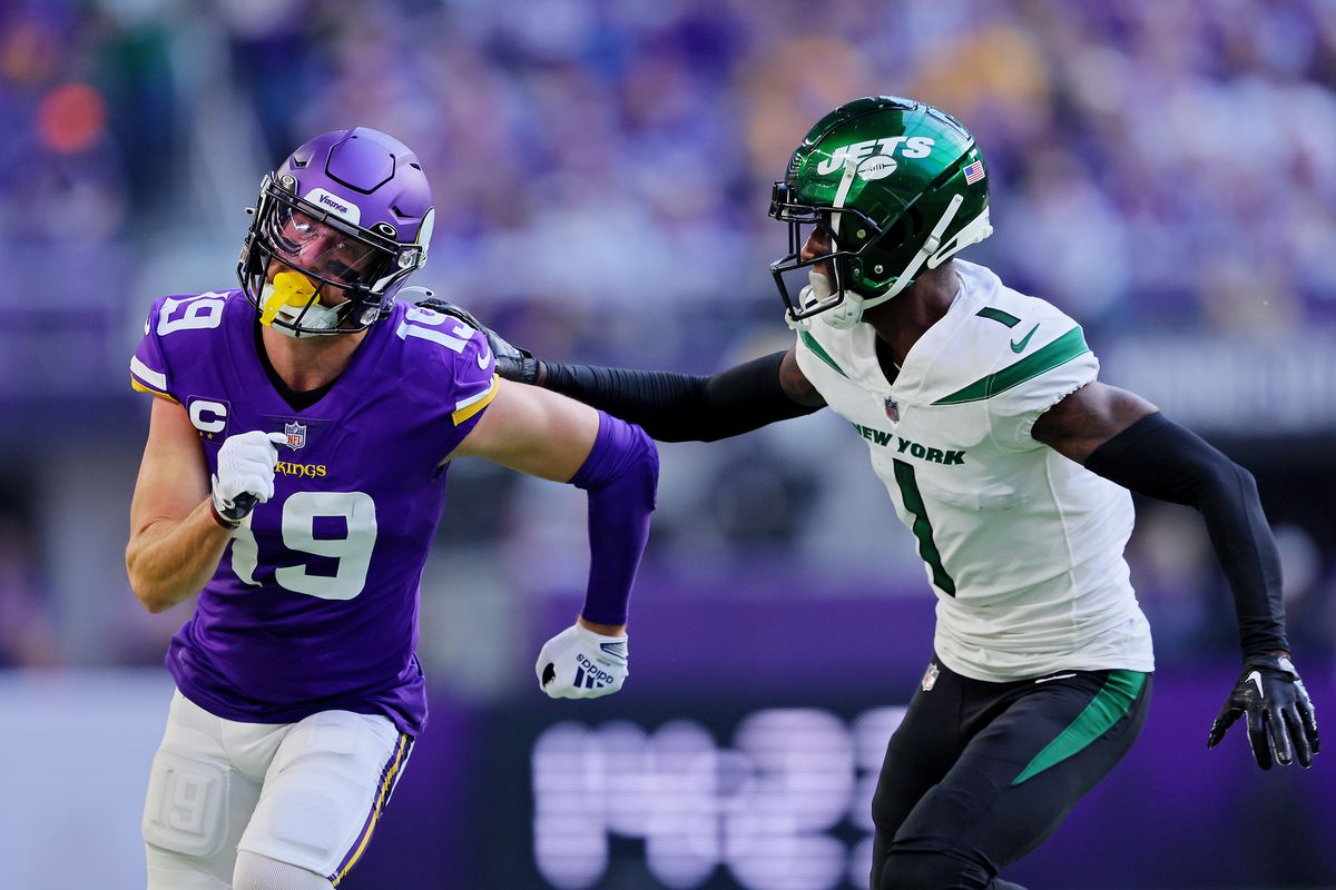 Adam Thielen #19 of the Minnesota Vikings runs a route while Sauce Gardner #1 of the New York Jets defends during the second quarter at U.S. Bank Stadium on December 04, 2022 in Minneapolis, Minnesota.