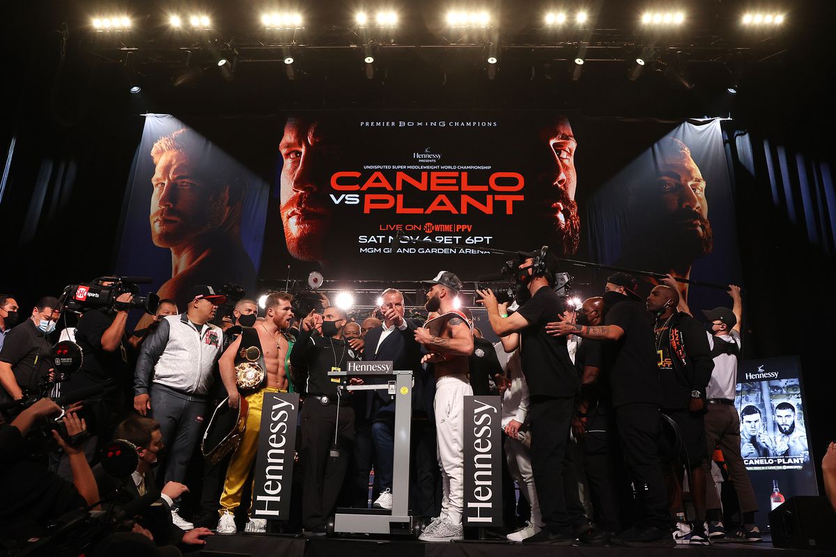 Canelo Alvarez and Caleb Plant face off face off during their official weigh-in at MGM Grand Garden Arena on November 5, 2021 in Las Vegas, Nevada.