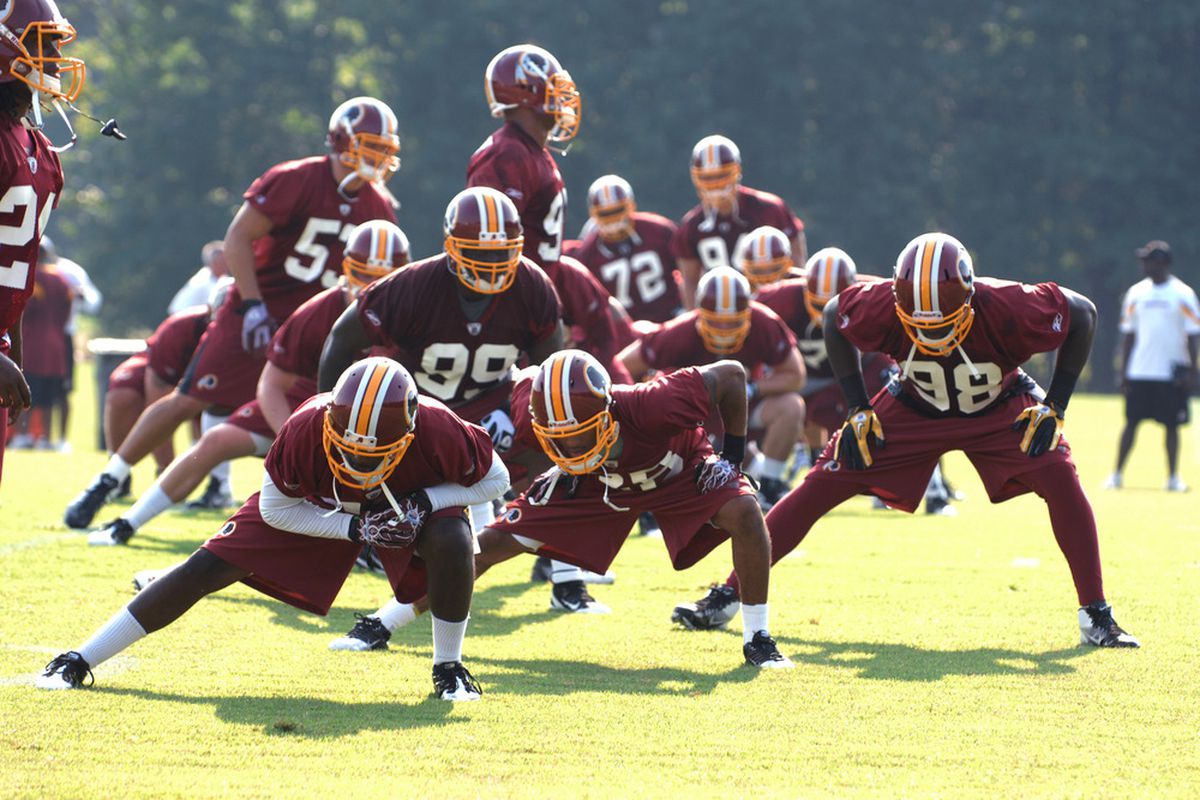 ASHBURN, VA - JULY 29:   Washington Redskins players stretch during the first day of training camp at Redskins Park on July 29, 2011 in Ashburn, Virginia.  (Photo by Mitchell Layton/Getty Images)