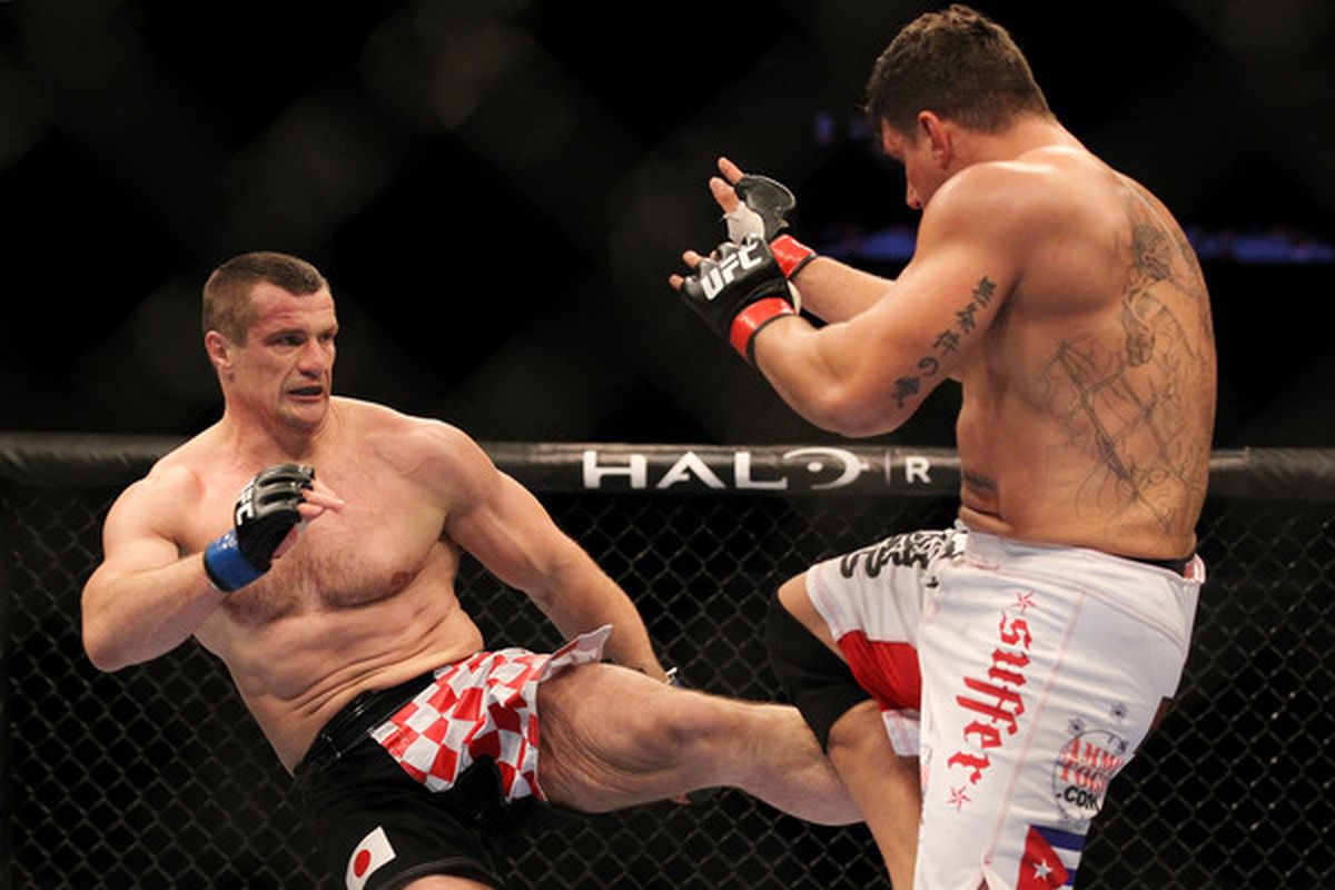 INDIANAPOLIS - SEPTEMBER 25:  (L-R) Mirko Cro Cop kicks Frank Mir during their UFC heavyweight bout at Conseco Fieldhouse on September 25 2010 in Indianapolis Indiana.  (Photo by Al Bello/Zuffa LLC via Getty Images)