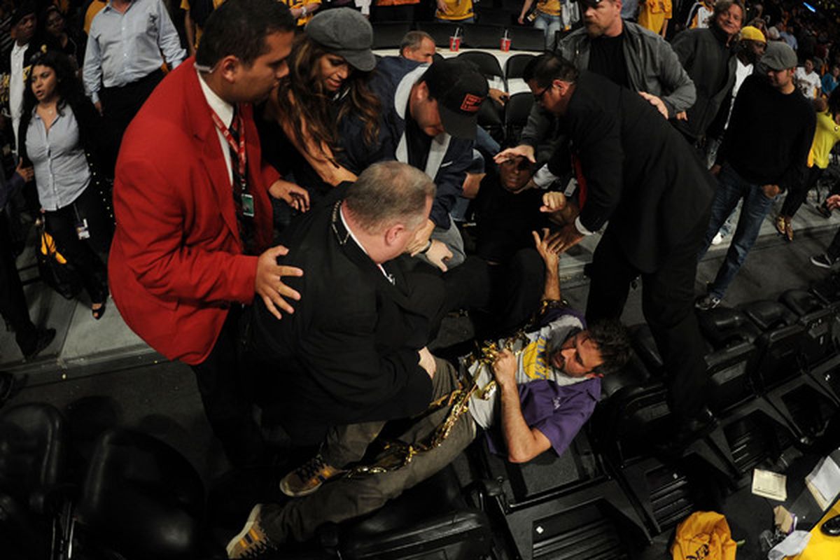 Nobody is safe in LA.  Actor David Arquette is knocked to the floor at the end of game. (Photo by Harry How/Getty Images)