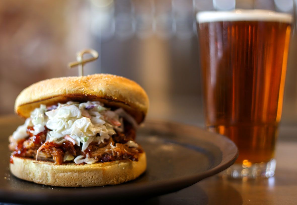 A pulled pork sandwich and a beer