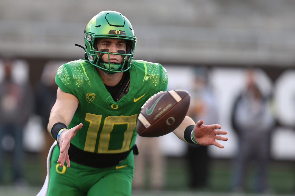 Oregon quarterback Bo Nix pitches the ball during the fourth quarter against Oregon State at Reser Stadium in Corvallis, Ore. on Saturday, Nov. 26, 2022.