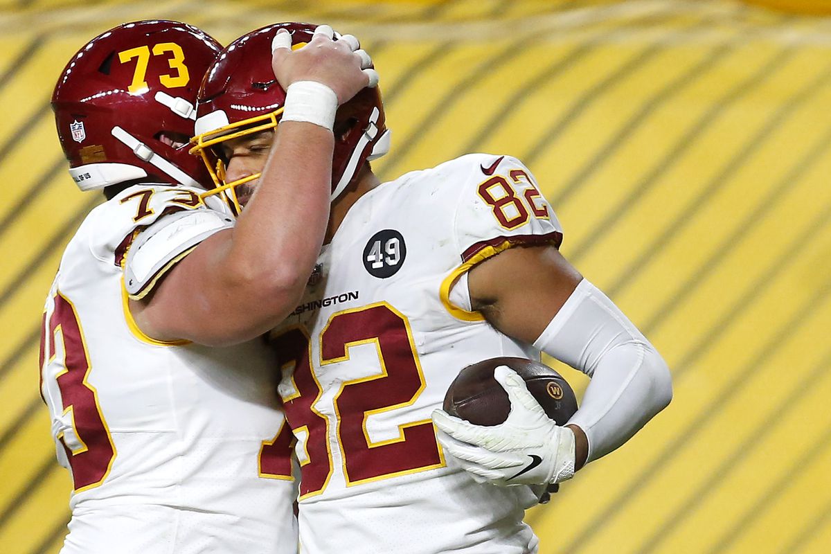 Logan Thomas #82 of the Washington Football Team celebrates with teammate Chase Roullier #73 following a touchdown catch during the second half of their game against the Pittsburgh Steelers at Heinz Field on December 07, 2020 in Pittsburgh, Pennsylvania.