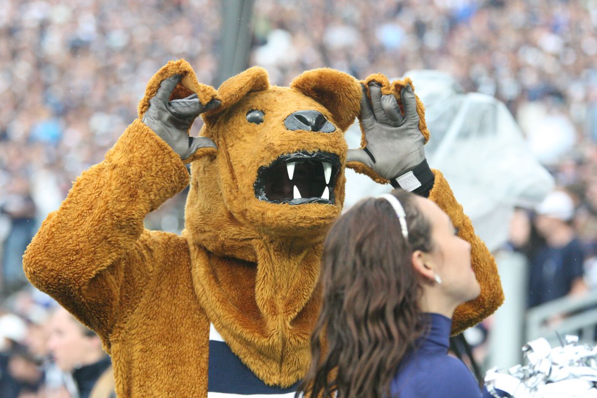 That poor, unsuspecting cheerleader is about to be eaten by the Nittany Lion. 