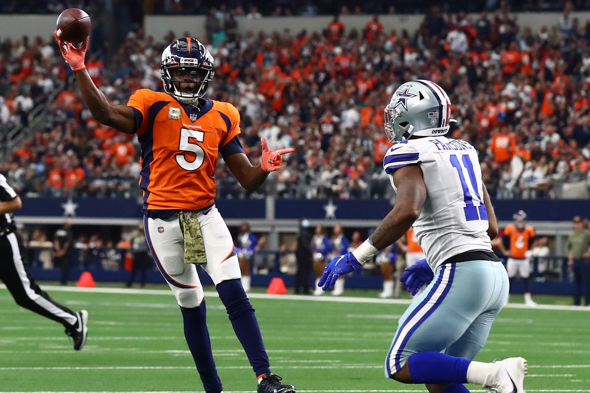 Denver Broncos quarterback Teddy Bridgewater (5) throws on the run for a two point conversion in the fourth quarter against Dallas Cowboys linebacker Micah Parsons (11) at AT&amp;amp;T Stadium.