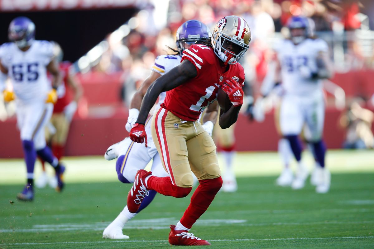 Brandon Aiyuk #11 of the San Francisco 49ers runs after making a catch during the game against the Minnesota Vikings at Levi’s Stadium on November 28, 2021 in Santa Clara, California.