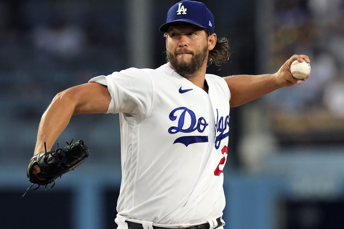 Starting pitcher Clayton Kershaw of the Los Angeles Dodgers throws against the Milwaukee Brewers during the second inning at Dodger Stadium on August 16, 2023 in Los Angeles, California.