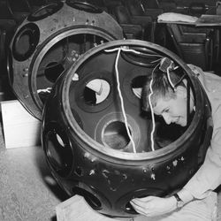 A technician assembles the Adler Planetarium’s Zeiss sky projector. 