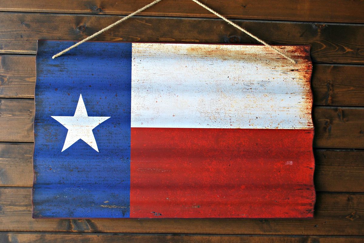 Texas flag painted on corrugated metal