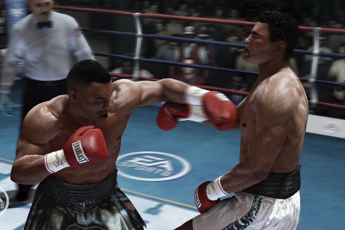 Mike Tyson stuns Muhammad Ali with an overhand left to the jaw, spittle flying from Ali’s mouth.