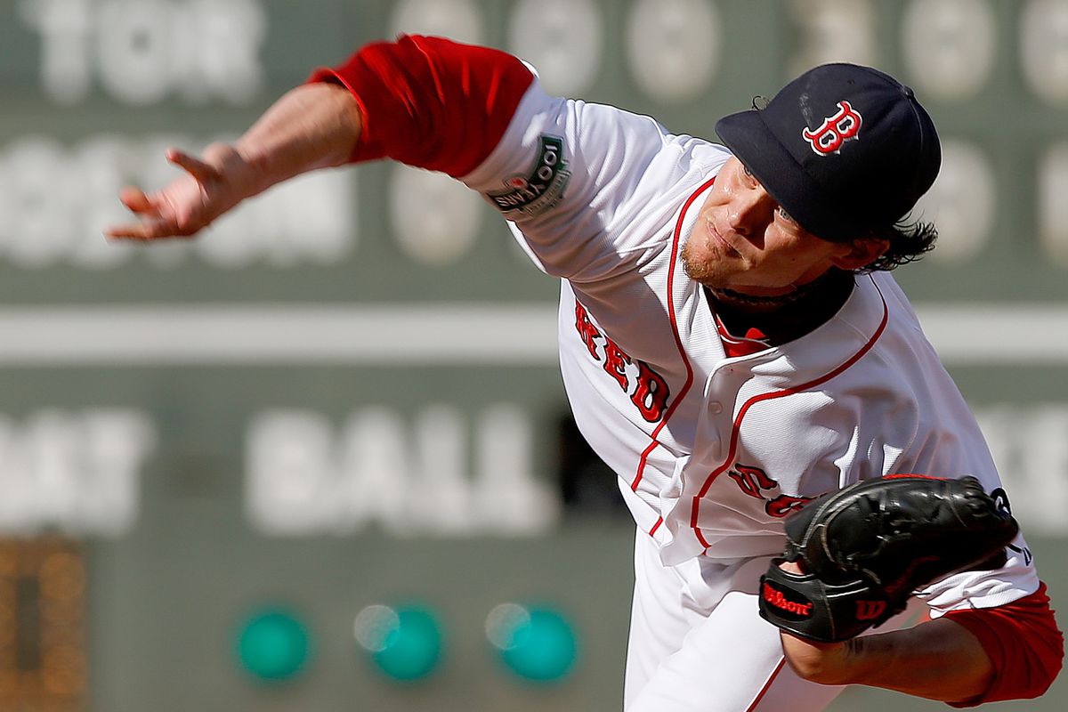 BOSTON, MA:  Clay Buchholz #11 of the Boston Red Sox throws against the Toronto Blue Jays in the seventh inning at Fenway Park in Boston, Massachusetts.  (Photo by Jim Rogash/Getty Images)