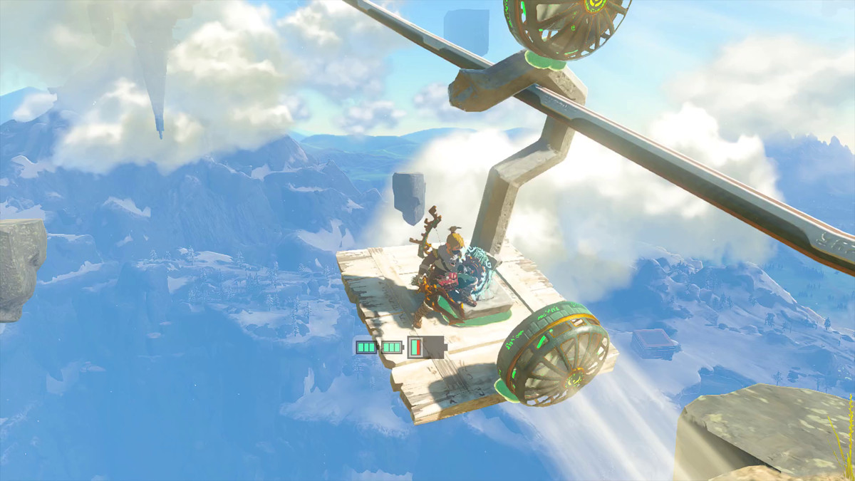 Link stands on a gondola made of scrap wood, a huge hook, and two fans in Tears of the Kingdom