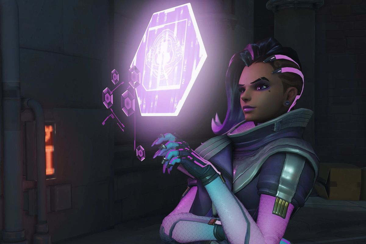 Sombra opens her holographic viewing panel in Overwatch 2